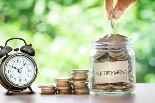 A clock with a jar labeled "retirement"