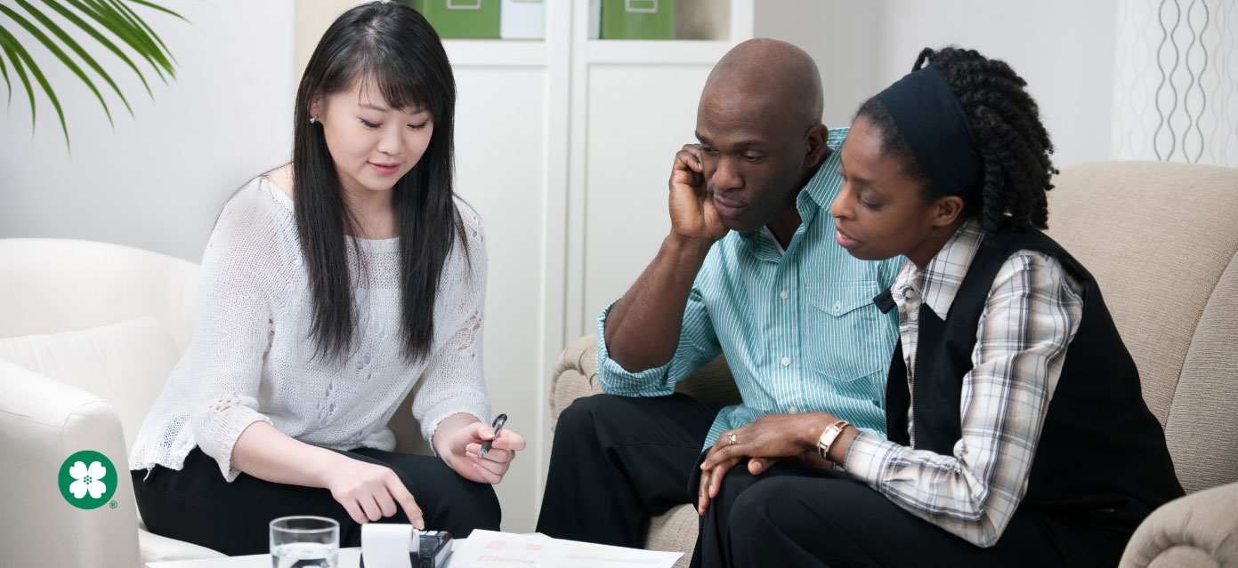 Young couple meeting with female advisor