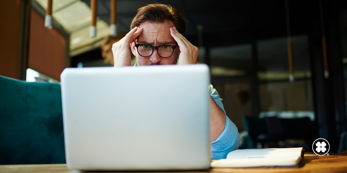 Concerned man looking at computer screen