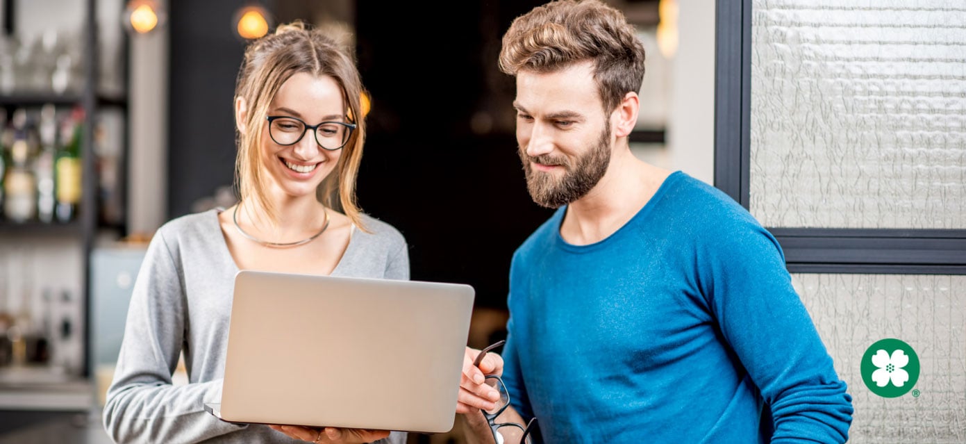 young couple looking at document