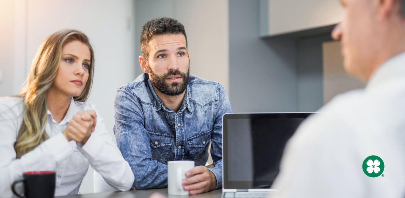 Young couple meeting with an investments agent