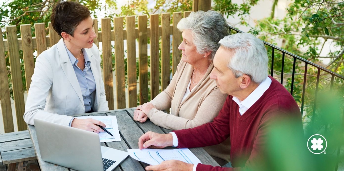 elderly couple meeting with a consultant