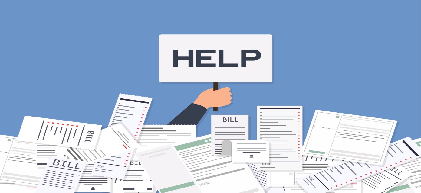A pile of bills with a hand sticking out holding a help sign