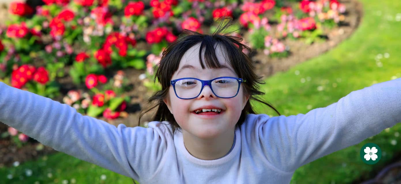child wearing glasses playing outside