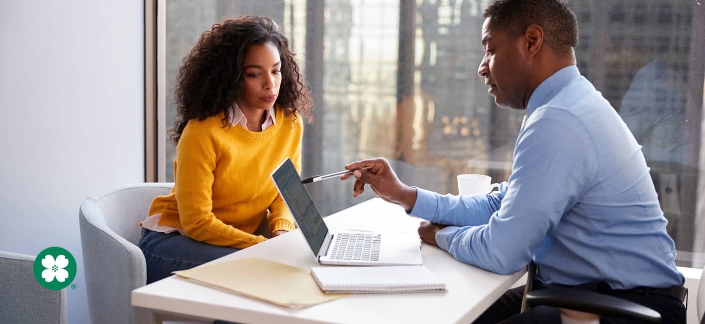 Woman sitting at desk meeting with advisor