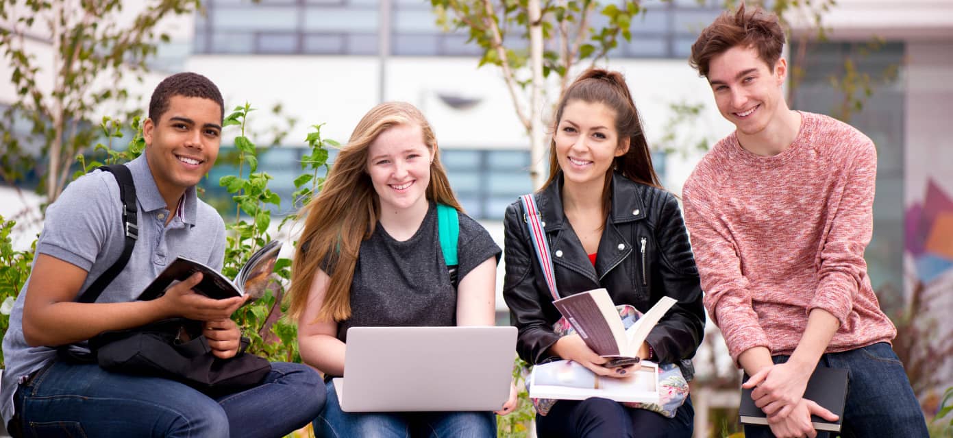 Male and female college students studying together