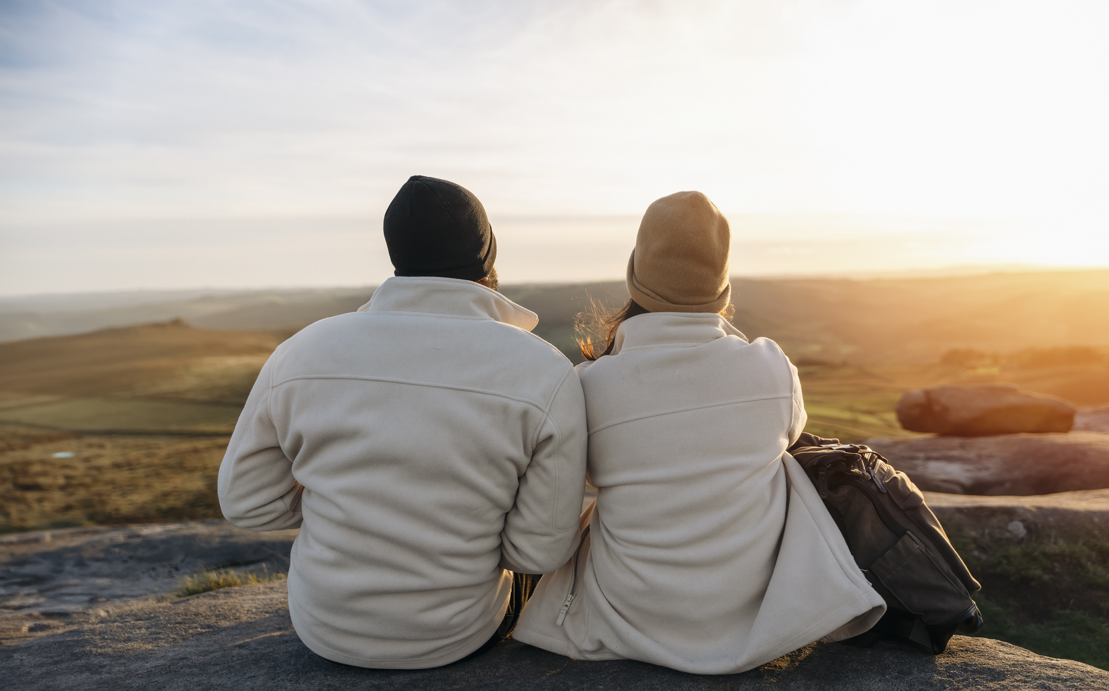 Couple sitting together outside