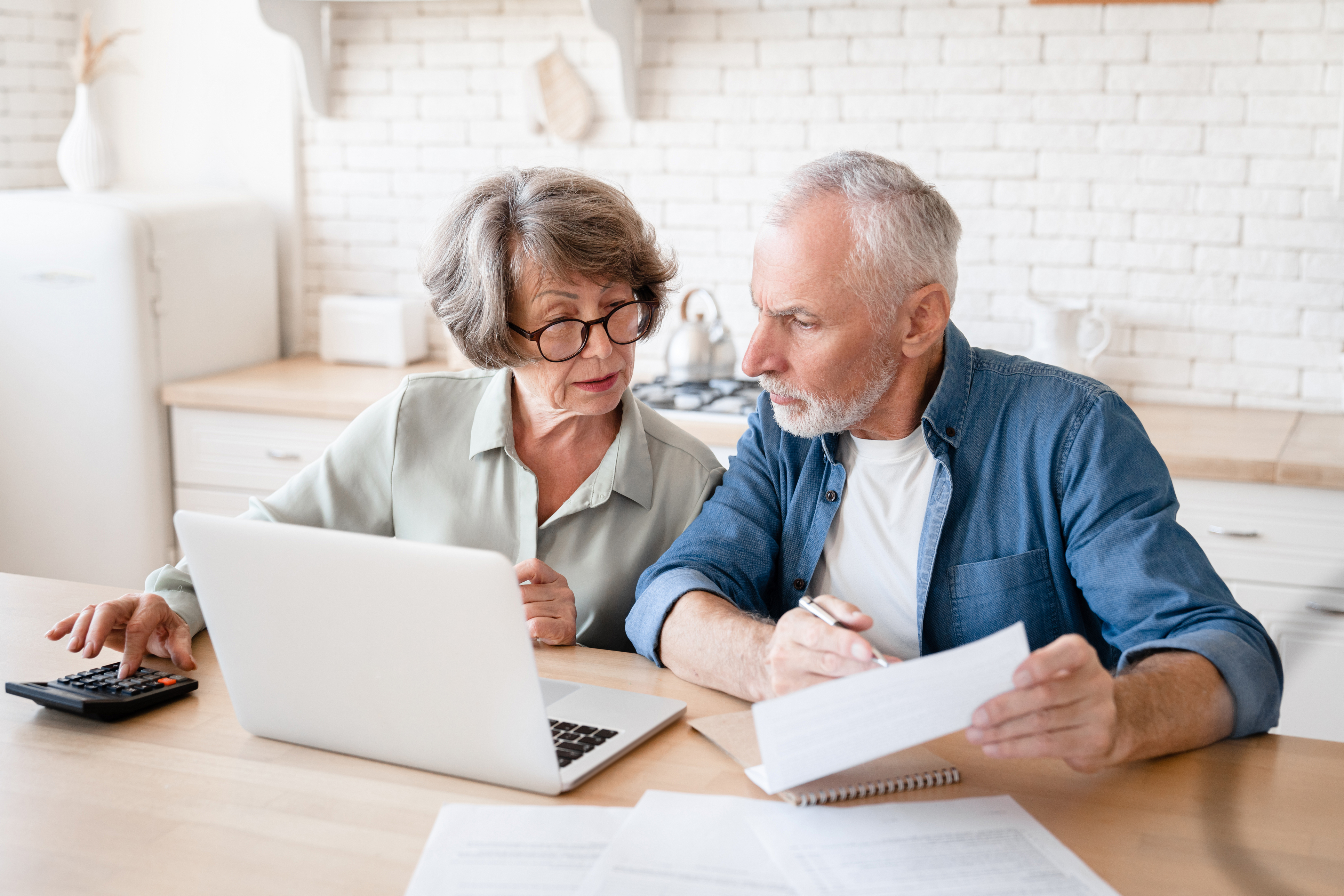 Couple sitting on computer