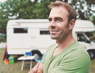 Man in front of a camper