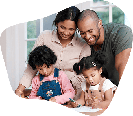 couple helping their 2 daughters with homework
