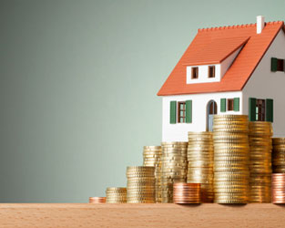 home with coin stacked in front of it